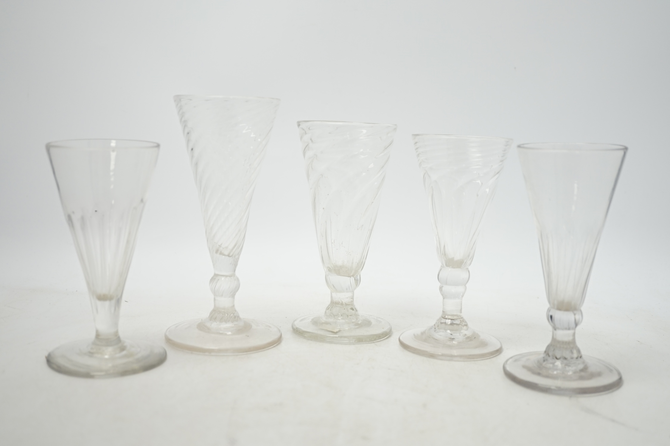 Five mid 18th century wrythen ale glasses, tallest 14.5cm. Condition - good